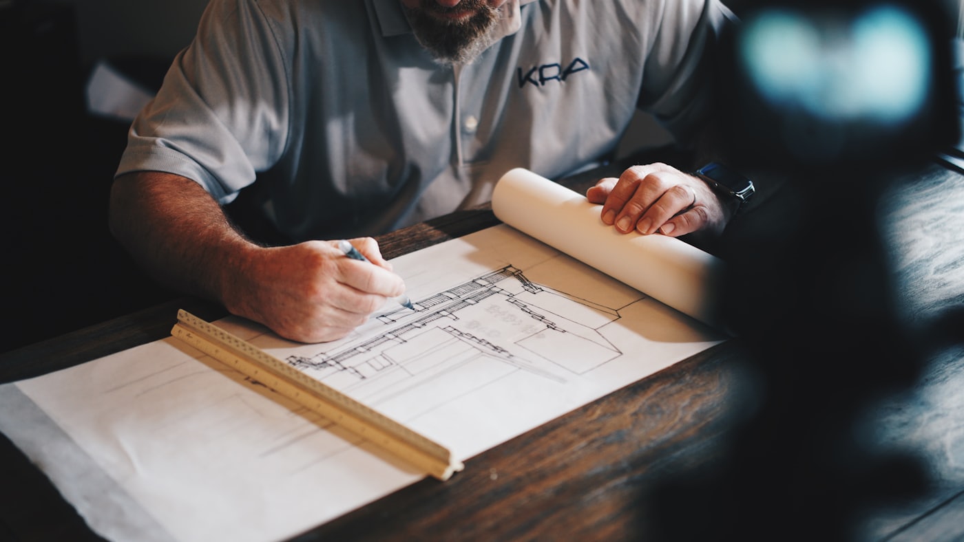 Estimator drafting a renovation plan